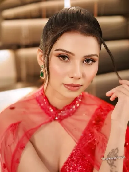 A close-up of the sophisticated cocktail look. We created a soft smokey eye and a neutral lip to balance the drama of the sparkling red gown.