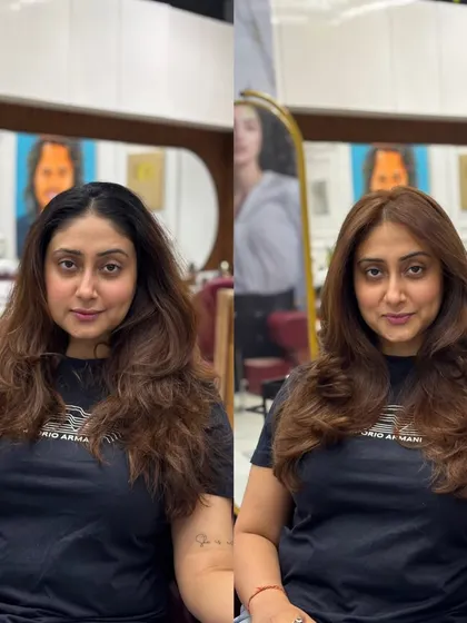 The client's happy face after her honey brown color and fresh new haircut.