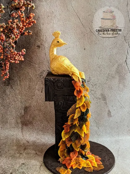 A duplicate of ID 127, this image captures the grandeur and intricate detail of the fall-themed peacock cake.