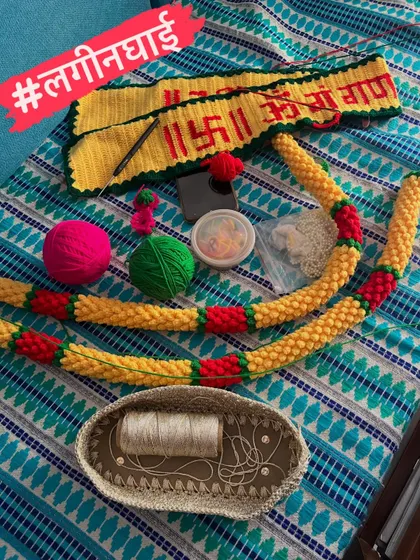 The wedding season rush, or 'लगीनघाई', is not just in the wedding home, but here in my workshop too. This photo shows a Ganpati toran and a marigold garland in progress, essential items for the Maharashtrian 'Rukhwat' wedding display.