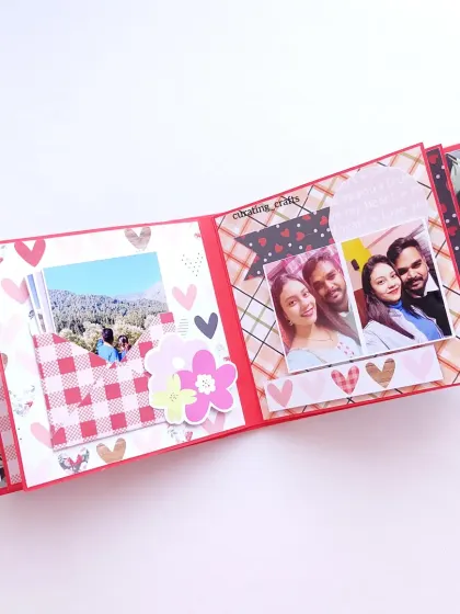 This page layout includes a pocket for a hidden photo and a collage of couple pictures, all tied together with a romantic theme.