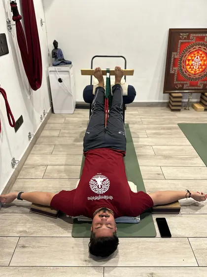 Restorative poses like Viparita Karani (Legs-Up-the-Wall Pose) are powerful tools for calming the nervous system. This gentle inversion improves circulation, reduces muscle tension, and regulates the breath, promoting deep relaxation.