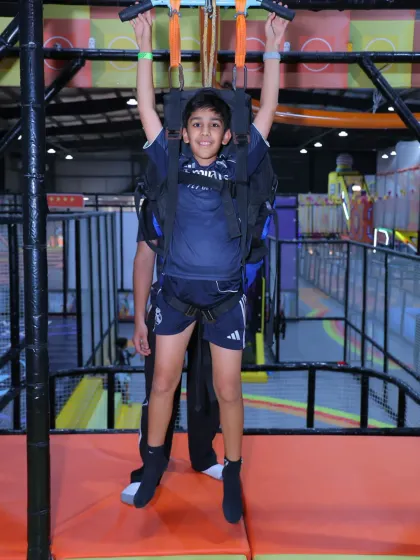 Get ready to fly across the park on our indoor zipline! It's a thrilling ride that gives kids a unique bird's-eye view of the action below, all while secured in a professional safety harness.