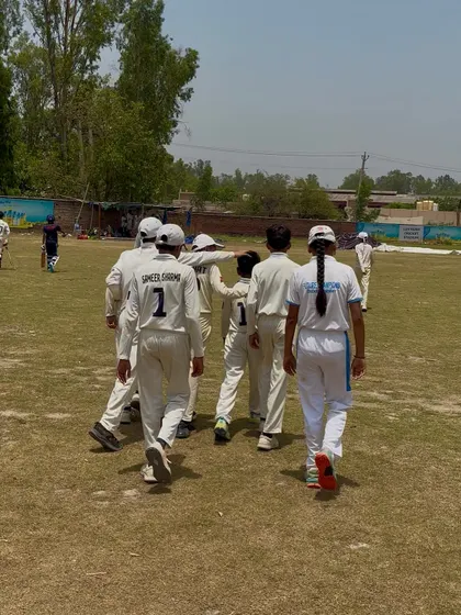The team walking together, united in their goal.