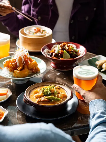A lifestyle shot from Yautcha, showing a couple enjoying their meal. This helps potential customers imagine themselves dining at the restaurant.