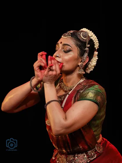 A gesture of blowing a conch, a powerful and evocative moment in abhinaya.