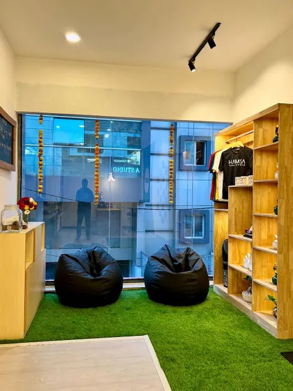 A cozy corner in our studio with bean bags and a view of the city. It's a perfect spot to relax and connect with fellow members before or after your class.