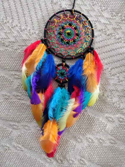 Sometimes all you need is a little splash of color. This rainbow dreamcatcher car hanging is sure to bring joy and boho vibes to any journey.