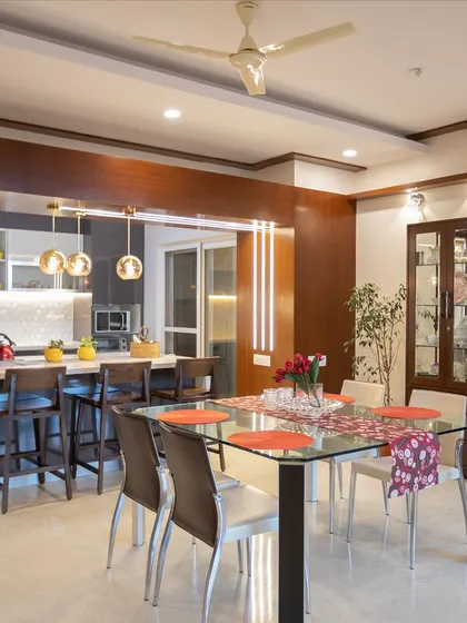 This shot shows how the open kitchen and breakfast bar integrate with the formal dining area. It creates a wonderful, connected space for the family to gather and share moments together.