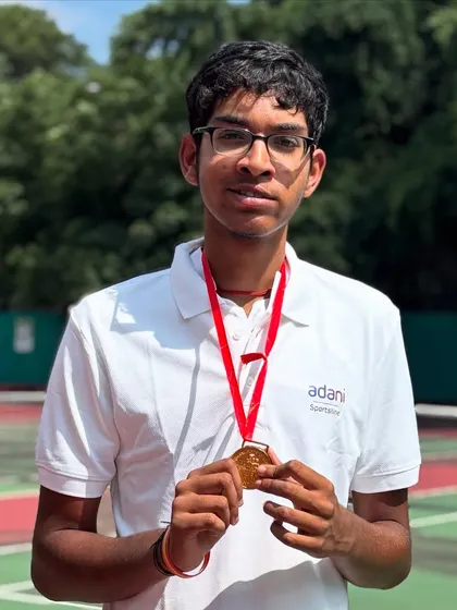 A close up on victory. This is the gold medal from the National Tennis Championship. For us, it represents more than a win; it's a symbol of breaking barriers and the culmination of countless hours of personalized, adaptive tennis training.