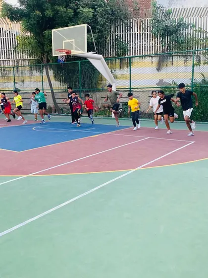 A group of players sprinting during a fitness session, pushing their physical limits.