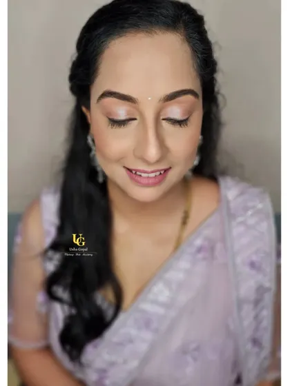 A close-up of Ranjini's subtle and elegant makeup. The soft, shimmery eyeshadow and natural lip color create a minimalist look that is both modern and timeless.
