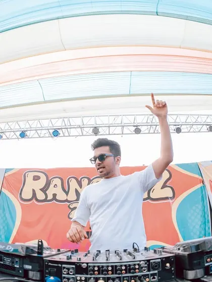 On the decks at the 'Rangrez' Holi festival. The fish-eye lens captures the massive stage and the vibrant setup.