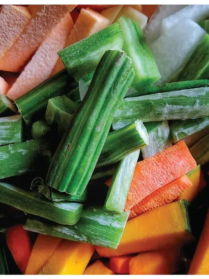 A close-up of the meticulously chopped vegetables for Avial, a testament to a grandfather's precision.