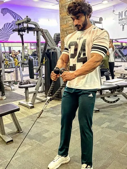 Cable curls for a great bicep pump. Using cables provides constant tension on the muscle throughout the movement.
