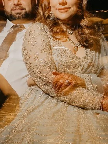 A cool, relaxed portrait of the couple taking a moment together during their cocktail party. The motion blur adds a dreamy, atmospheric quality.