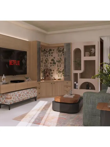 In this layout, we seamlessly integrated a corner pooja unit with the TV console. The use of consistent wood tones and a subtle wallpaper in the mandir creates a cohesive look for the entire living space.