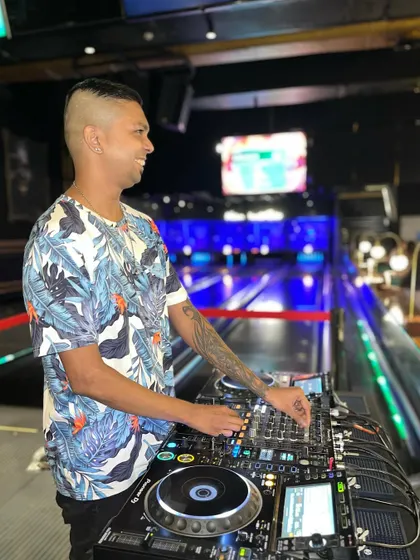 Spinning tracks at a private event with a unique bowling alley backdrop. I can set up and play in any environment to match your party's theme.