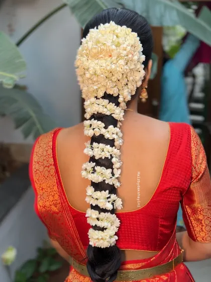 Another angle of the beautiful jasmine-covered braid, showing the fullness and fragrance of this timeless bridal hairstyle.