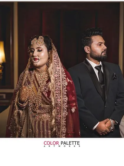 A stylish and moody portrait of a bride and groom. This showcases a more editorial approach to wedding photography, creating a dramatic and memorable image.