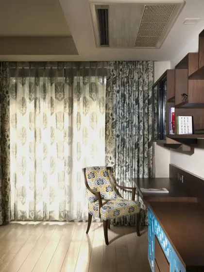 The study table at Casa K fits effortlessly into the bedroom, with clean lines and a pop of yellow in the drawers for refreshing energy. The cantilevered design and wooden side units create a functional environment that encourages both focus and inspiration.