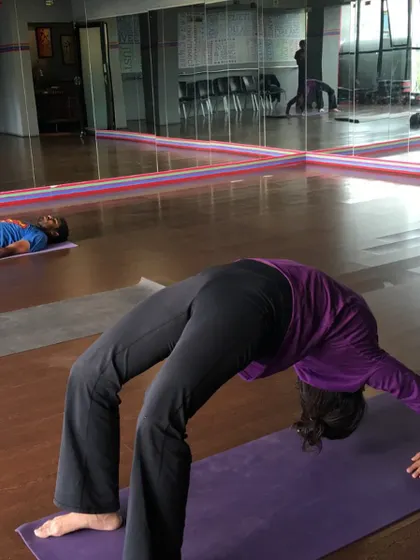 A practitioner in Urdhva Dhanurasana (Wheel Pose). This photo was taken seven years ago when the shala first opened. It has since become an anchor in my life, a space where people from all walks of life can come to practice.