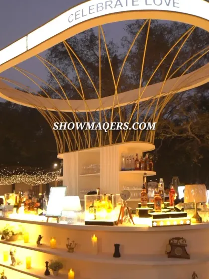 The bar is a central feature of any social event, and we design them to be showstoppers. This custom-built circular bar features a dramatic overhead structure, ambient lighting, and multi-level displays to create an unforgettable guest experience.