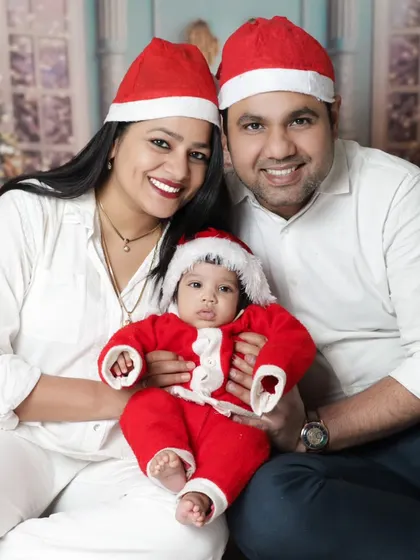 Christmas is for family. We love when parents join in for our festive mini-sessions. This beautiful family portrait captures the joy of their baby's first Christmas.