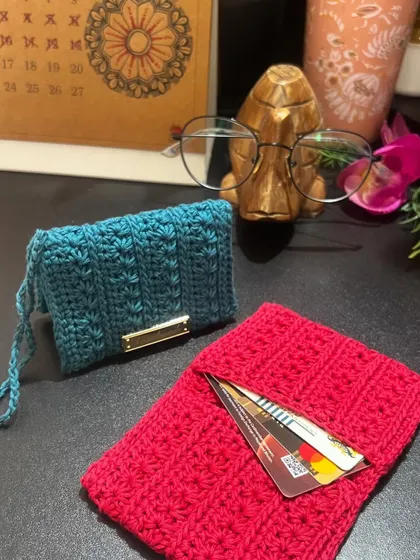 Another view of the pink and blue wallets. The blue one is shown holding cards to give you an idea of its capacity.