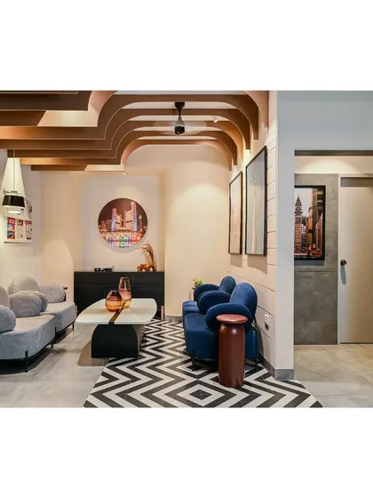 Another view of the reception area, showcasing the interplay of patterns, colors, and the sculptural ceiling fins that define the office's unique design language.