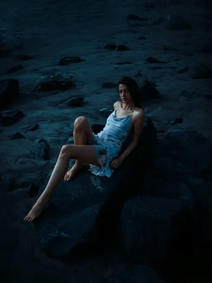 A full-length shot that uses the natural landscape to create a dramatic and moody scene. Perfect for an editorial story.