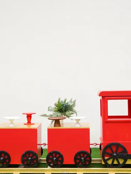 Our dessert train prop is also available in a classic red. The open carriages are perfect for displaying cakes, cupcakes, and other party treats.