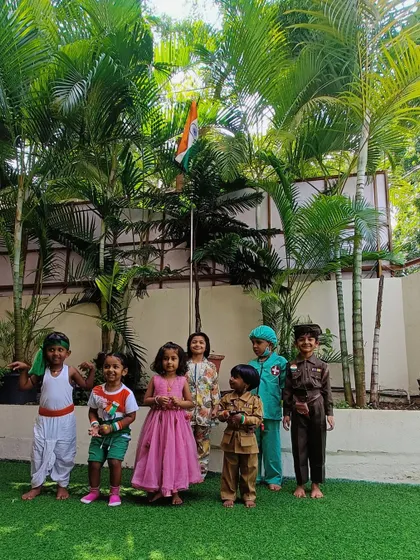 Another proud moment from our Independence Day event, with children gathered under the tricolor, fostering a sense of national pride.