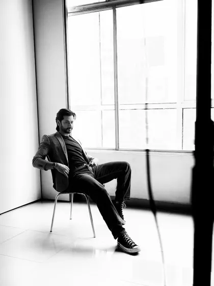 Another monochrome shot from the same session, this time with the model relaxed against the window. Using natural light in a studio creates a soft, timeless look that works beautifully for portraits.
