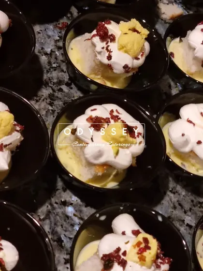 Our take on a classic Indian dessert, Rasmalai, served in individual bowls with whipped cream and garnishes. We elevate traditional sweets with a modern presentation.