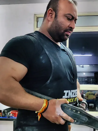 Getting geared up for a heavy lift. The focus is intense.