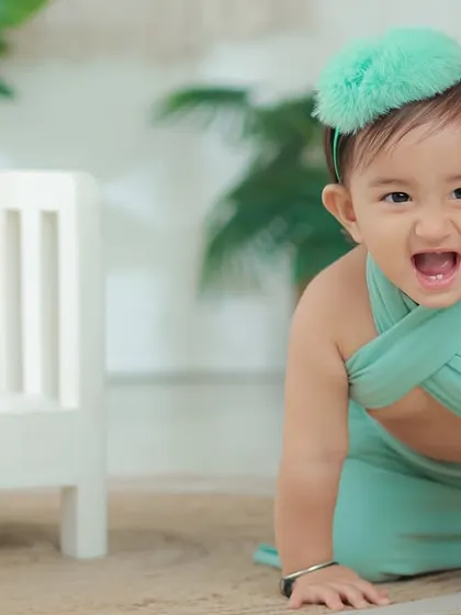 A playful, energetic moment. This crawling shot captures her personality and the beautiful movement of her mermaid-style dress.