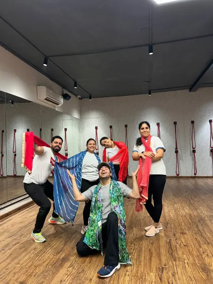 The TGA Fam celebrating Holi with colorful dupattas instead of messy colors.