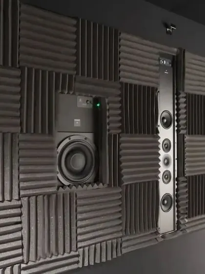 A look at a wall of professional-grade acoustic foam panels. This checkerboard pattern not only looks cool but is highly effective at diffusing and absorbing sound waves for a clean audio experience.