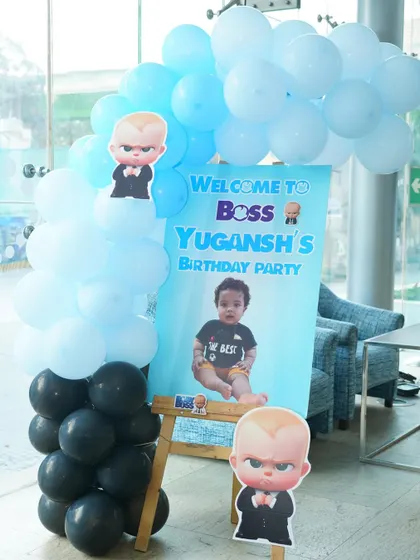 A personalized welcome board for a Boss Baby-themed party.