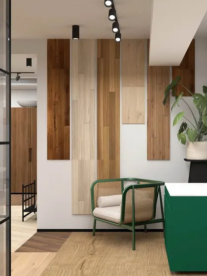 A render of a welcoming nook in the retail showroom, featuring a comfortable chair, a pop of green from the side cabinet, and a feature wall of vertical wood panels.