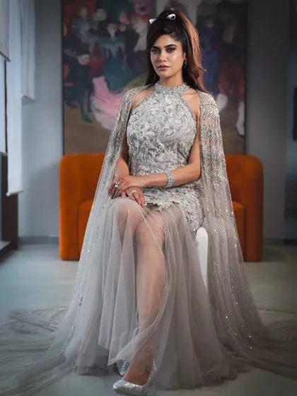 An ethereal, high-glam look for Aaditi Pohankar. The sequined gown with a cape was paired with dramatic eyes and a soft, romantic hairstyle.