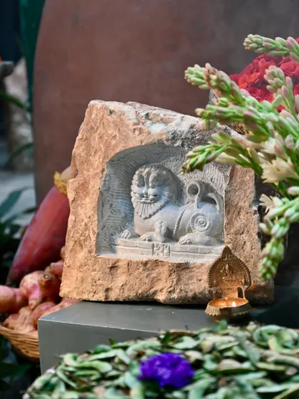 A niche carving in stone of a Yali, a mythical creature, displayed with a small diya. This piece is part of my new collection for 2025, celebrating the harvest season and our rich artistic traditions.