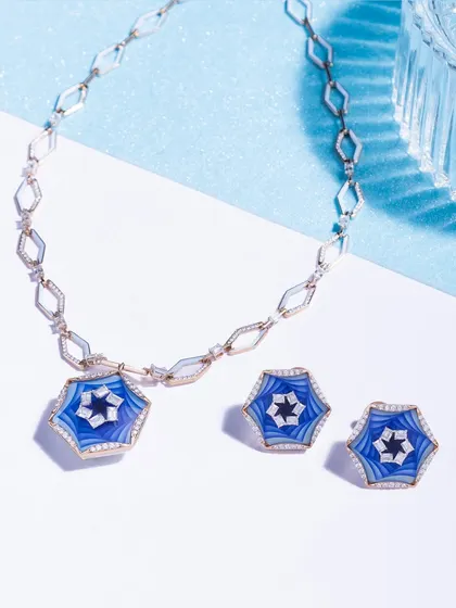 Versatile French 3D Enamel creates a symphony of innovation, colors, and textures. This geometric link chain necklace and earring set is sculpted as uniquely as your story.