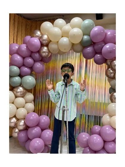 This young speaker addresses the audience with conviction, a result of our focus on building self-assurance and clear communication.