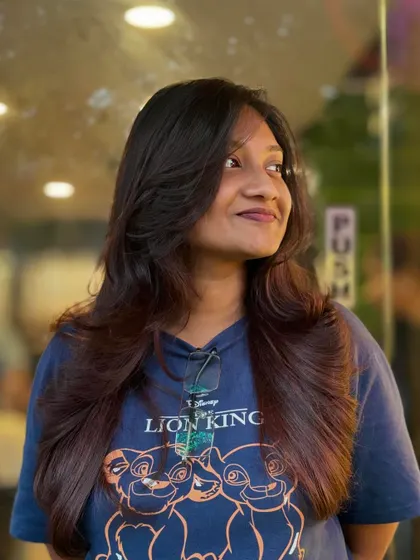 A beautifully executed layered haircut with soft waves. This style is perfect for adding volume and a touch of glamour, framing the face while keeping the length.