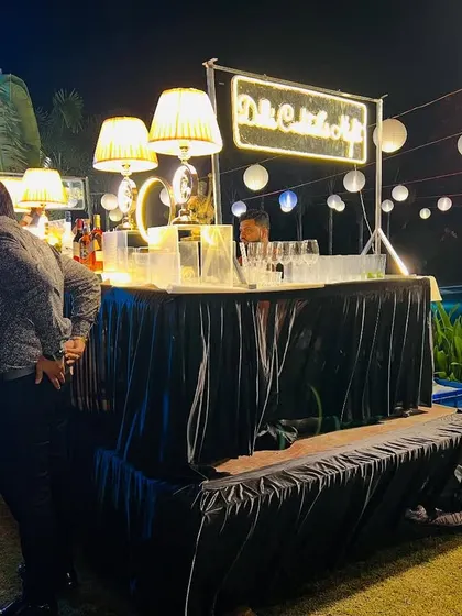 This image captures the atmosphere of the event, with guests enjoying the stylish bar area. A good setup encourages networking and enjoyment.