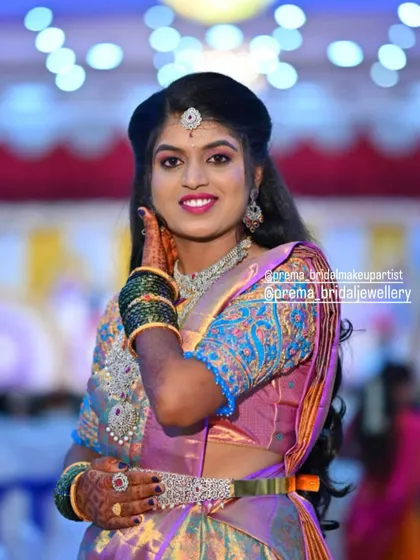 A close-up of bride Kaviya, showing the details of her sparkling necklace and earrings.