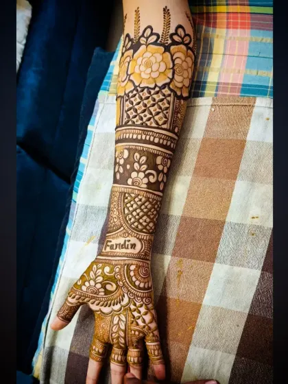 A full view of the single arm, showing how all the patterns come together in this personalized bridal design.