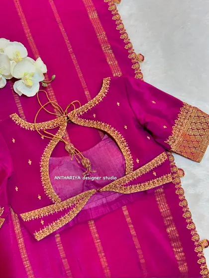 A simple magenta blouse with a stylish tie-up back design.